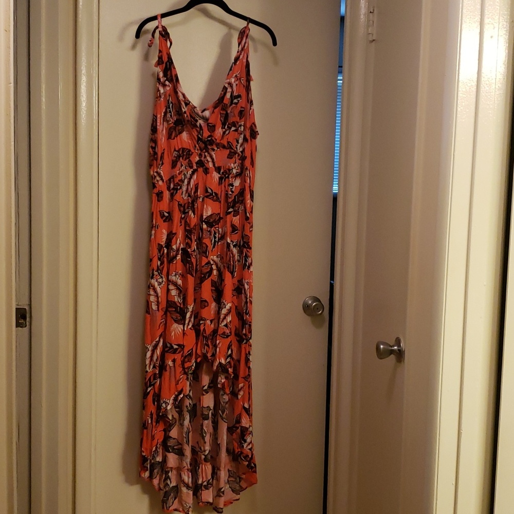 Orange floral printed high low dress. Empire waist. Straps tie at shoulders